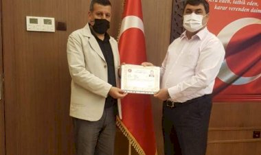 Kaymakam Şahin'den Yazar'a Üstün Başarı Belgesi 